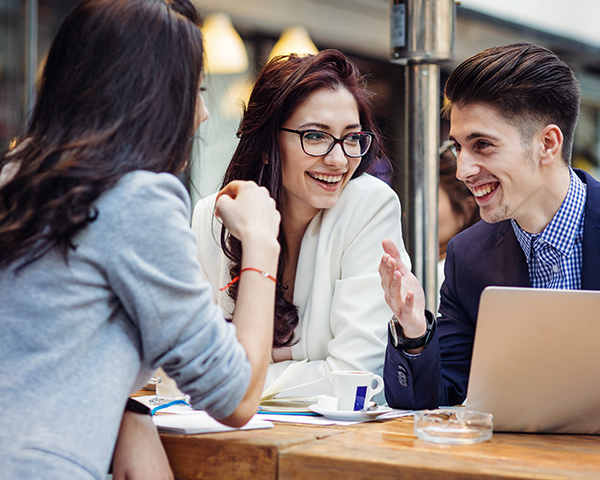 Photo of young people working and chatting.